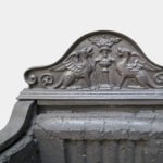 A POLISHED IRON FIREGRATE BY THOMAS ELSLEY