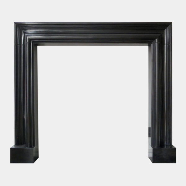 A Black Marble Bolection Fireplace