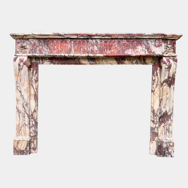 A Large Louis XVI Breche Marble Fireplace