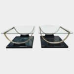 A Pair Of Black Lacquered And Brass End Tables