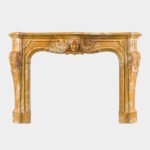 A Large Rococo Carved Siena Marble Fireplace